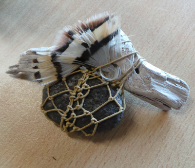 Netted Linen, rock, feather and driftwood